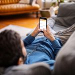 231031171837-man-using-cellphone-stock-image-restricted