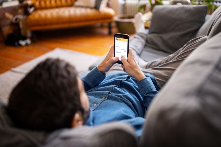 231031171837-man-using-cellphone-stock-image-restricted